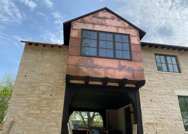 Copper metal panel facade on a stone building for Metal Roof Coating in Washougal