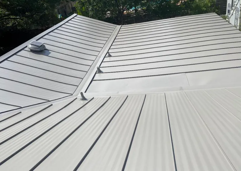 Solar attic fan installed on a metal roof for Roof Ventilation in Washougal
